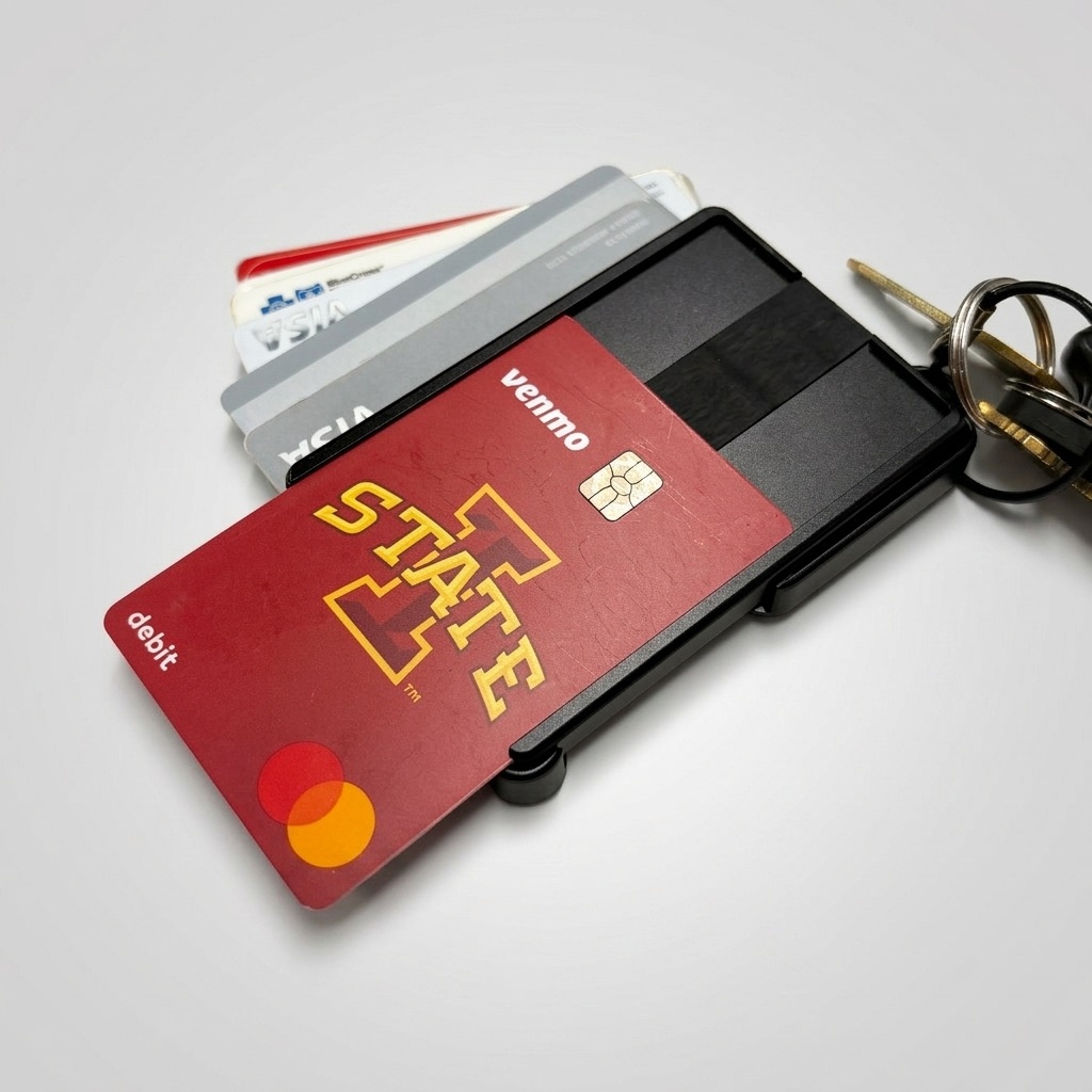 The metal Brik with ID, cards, and keys all extended